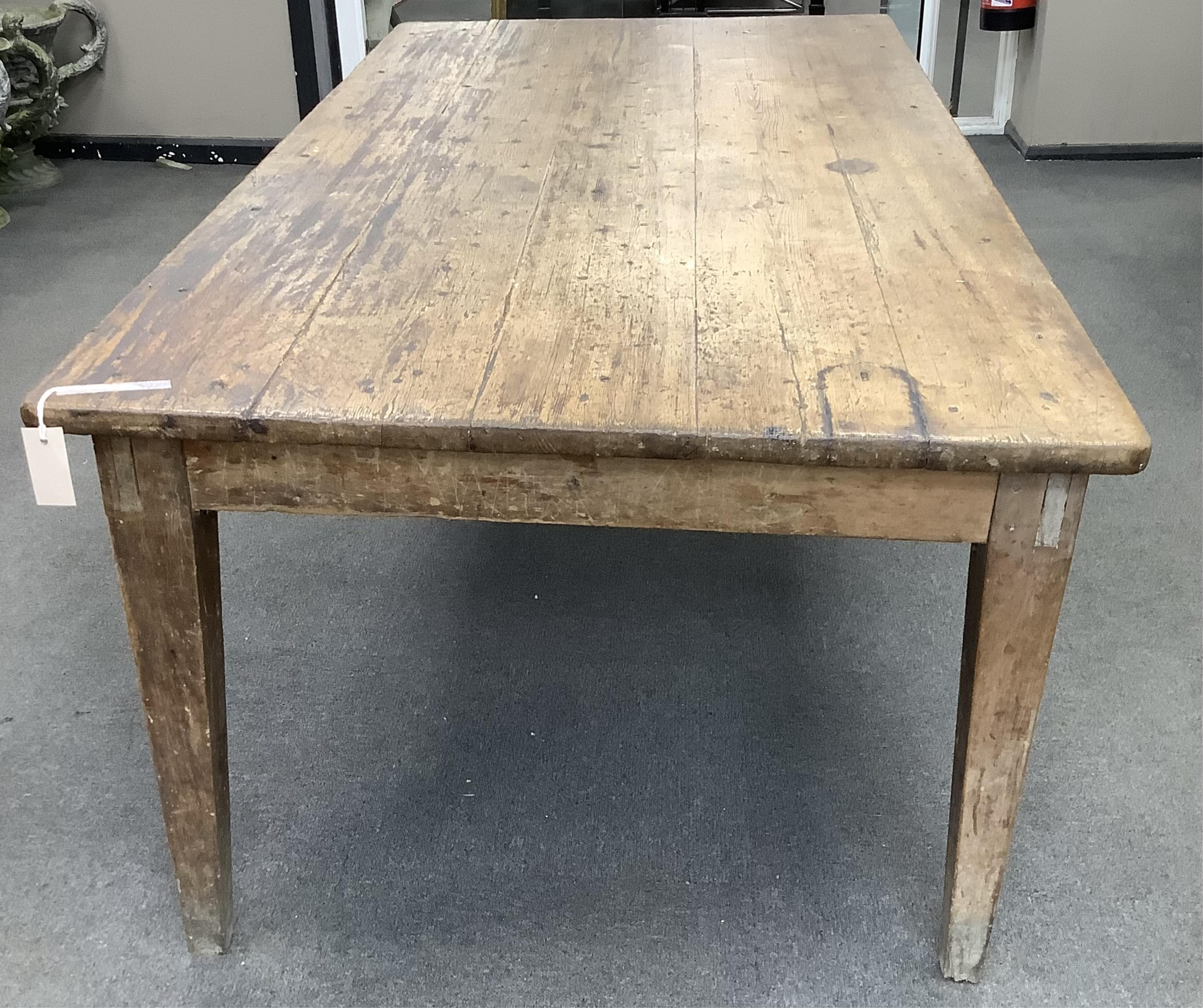 A 19th century French rectangular oak and pine kitchen table, width 198cm, depth 94cm, height 72cm. Condition - fair